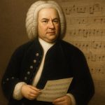 Portrait of Johann Sebastian Bach with sheet music